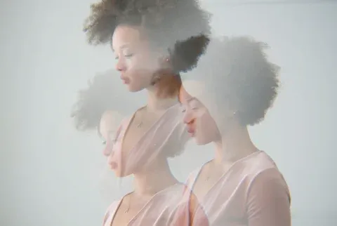 Multiple Exposure Portrait Of The Profile Of A Woman With Eyes Closed