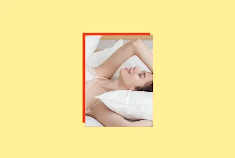 photo of woman on bed with arms over her head on yellow background