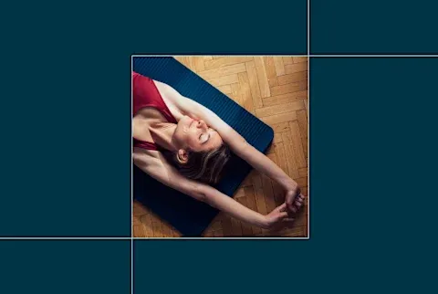 image of top half of woman with arms stretched out overhead on yoga mat on blue background image of top half of woman with arms stretched out overhead on yoga mat on blue background