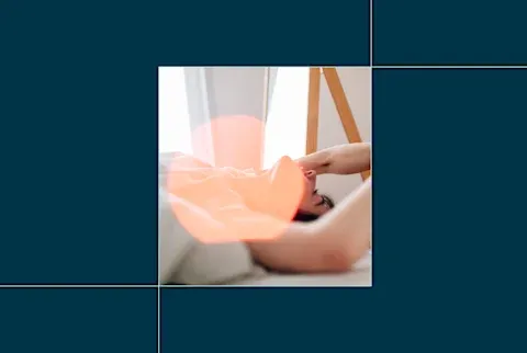 woman in bed with arms above her head