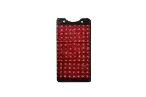 rectangular, black, flexible mat or pad with a large grid of small, illuminated red lights covering its surface