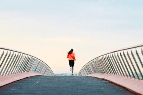 Woman Running Along a Path in the morning