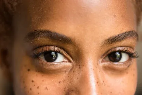 woman up close with long eyelashes woman up close with long eyelashes
