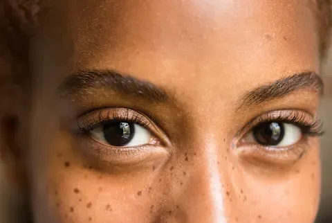 woman up close with long eyelashes