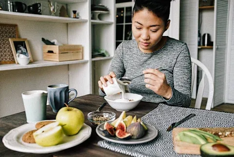 Woman Eating Healthy Breakfast