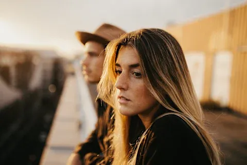 Sad Thoughtful Woman Standing Outside with Her Partner