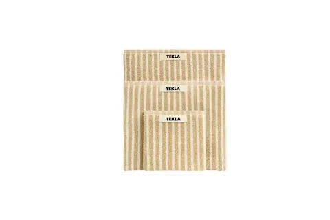 A stack of three folded towels of graduating sizes from Tekla