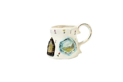 Whimsical, hand-painted ceramic mug for an artful morning ritual.