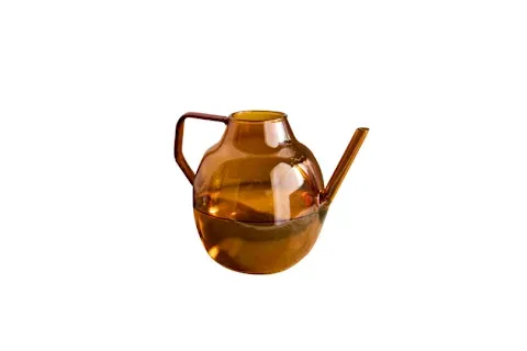 Chic amber glass can that turns watering into a luxurious daily ritual.