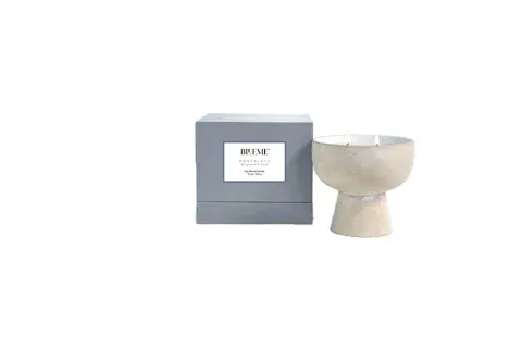 soy blend candle in a cream ceramic vessel from Blueme 