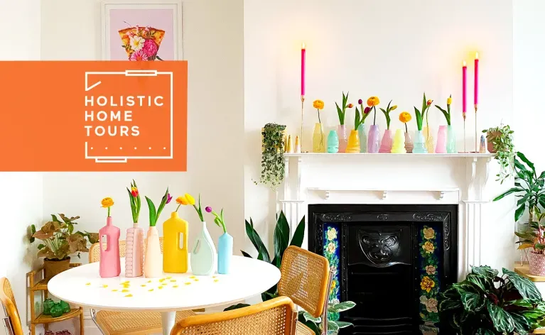 dining area with colorful vases, wicker chairs, and plants