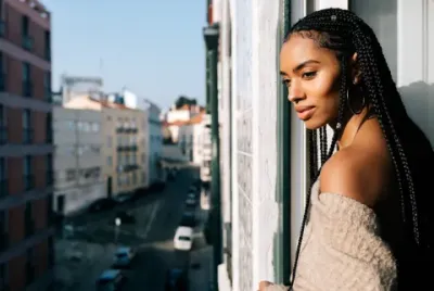 Woman Looking Out a Window