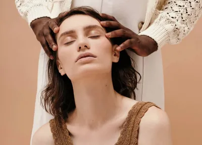 Woman receiving a relaxing scalp massage