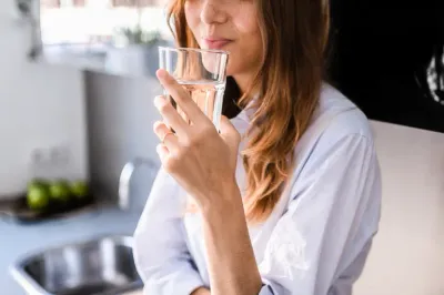 Woman Drinking Water in The Morning