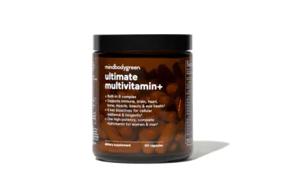 Ultimate multivitamin+ in an amber glass bottle against white background