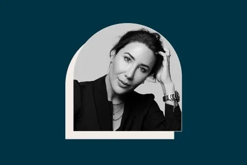 black and white photo of a woman resting her head on her hand with a navy blue background black and white photo of a woman resting her head on her hand with a navy blue background