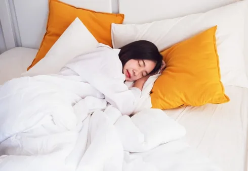Woman Sleeping Against Pillows Woman Sleeping Against Pillows