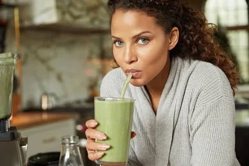 denise vasi drinking a green smoothie denise vasi drinking a green smoothie